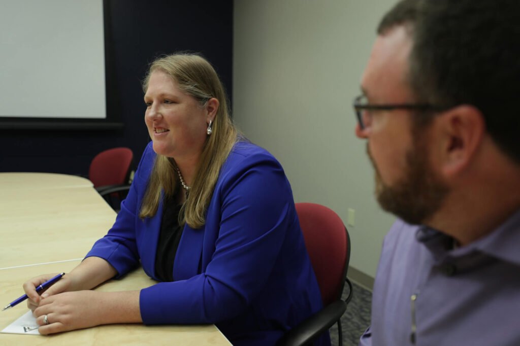 Atchley & Associates team members seated at a conference table during a meeting